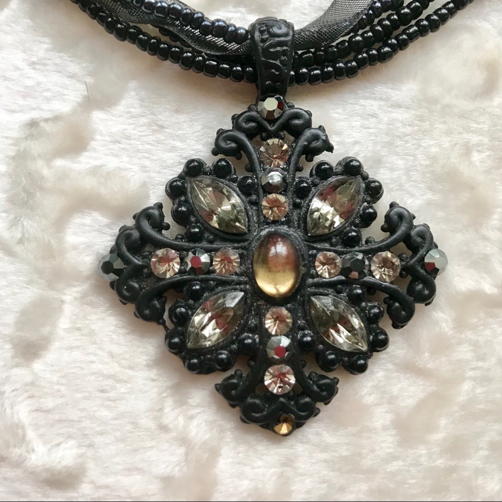 Celtic cross jeweled pendant on multistrand necklace
